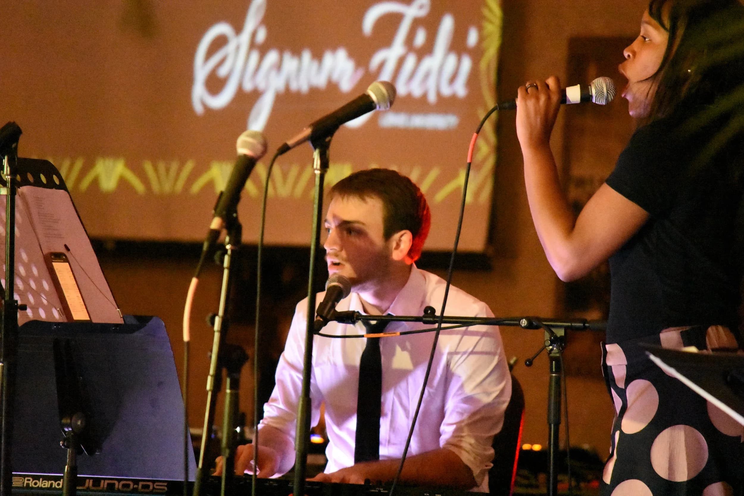 Jake Kobler performing on keys in a live setting.
